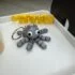Articulated Fidget Octopus Keychain - flexible 3D printed stress-relief keychain by Adomeez