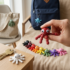 Purple articulated 3D printed fidget octopus keychain by Adomeez