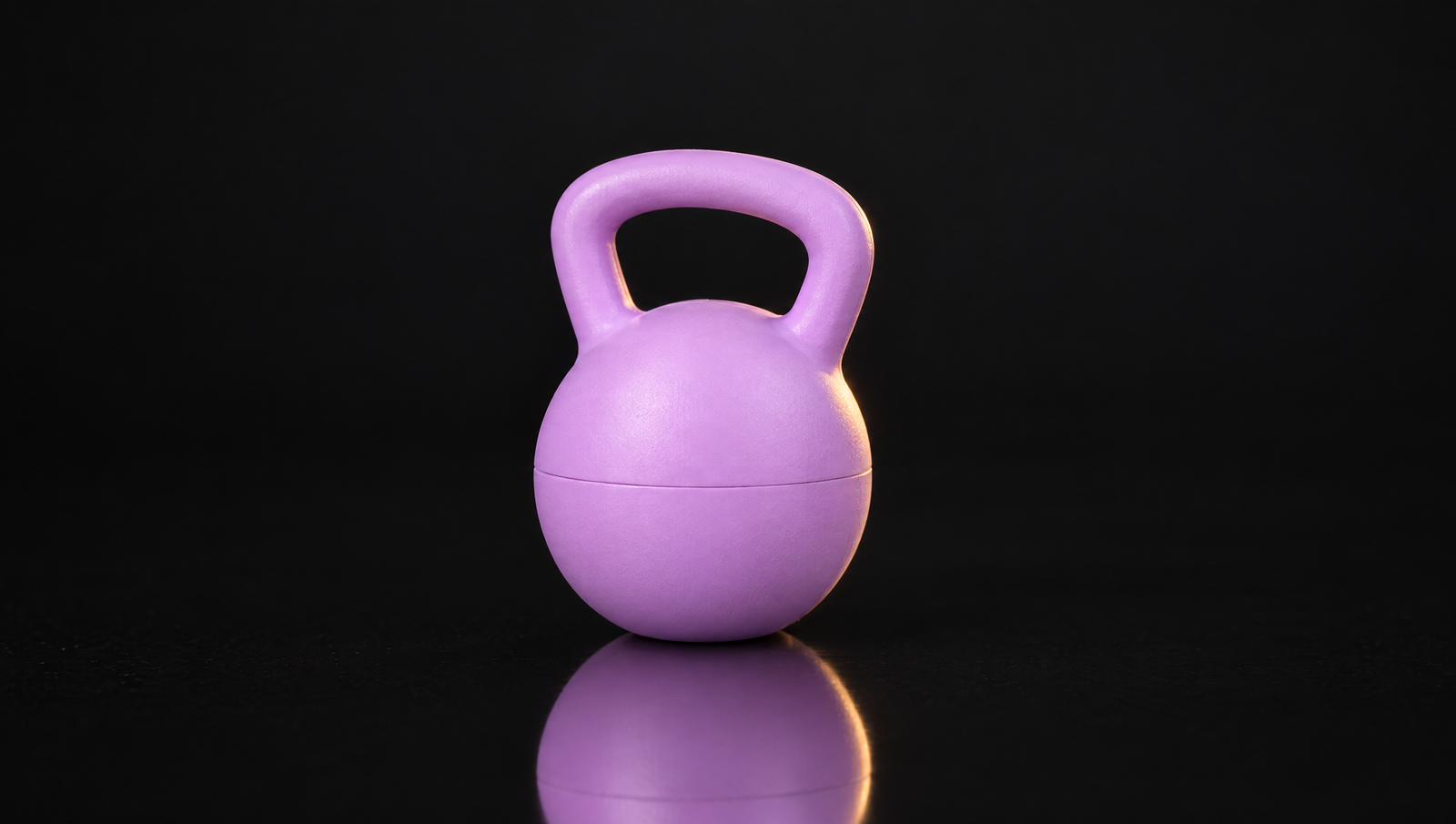 Purple kettlebell keychain on black background